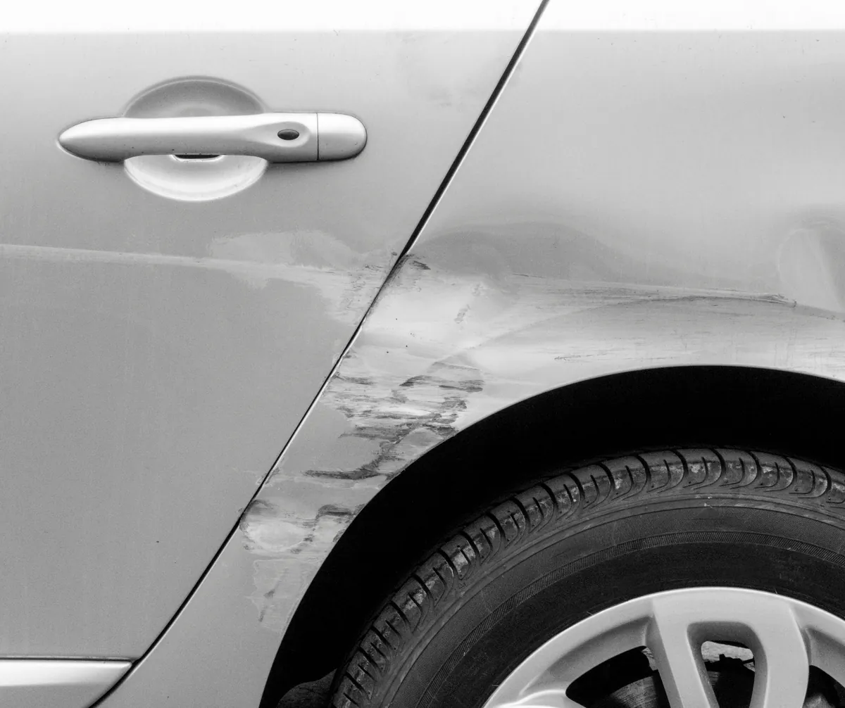 Close-up of body damage before repair